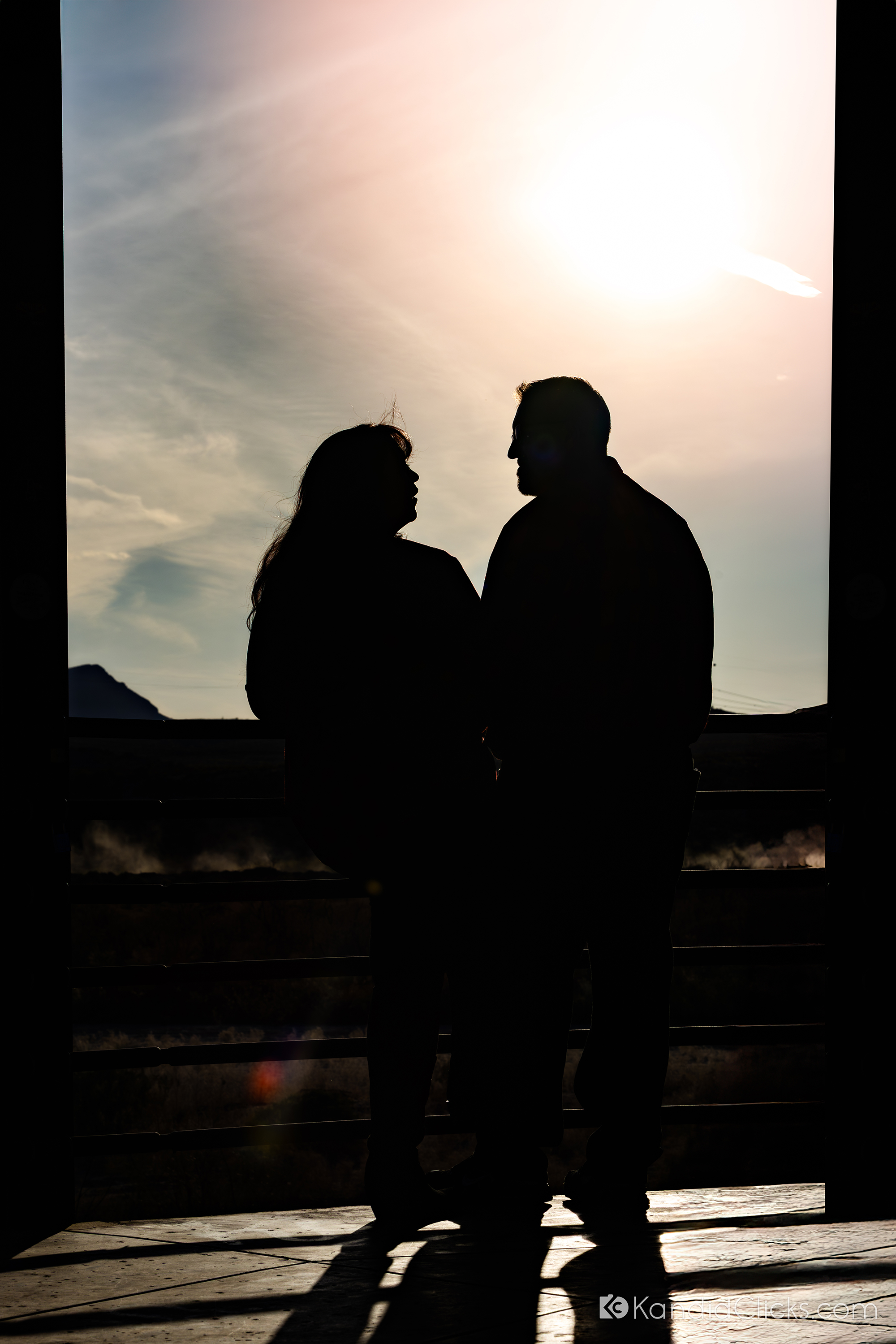 Silhouette of a couple sharing a quiet moment during sunset in Arizona.