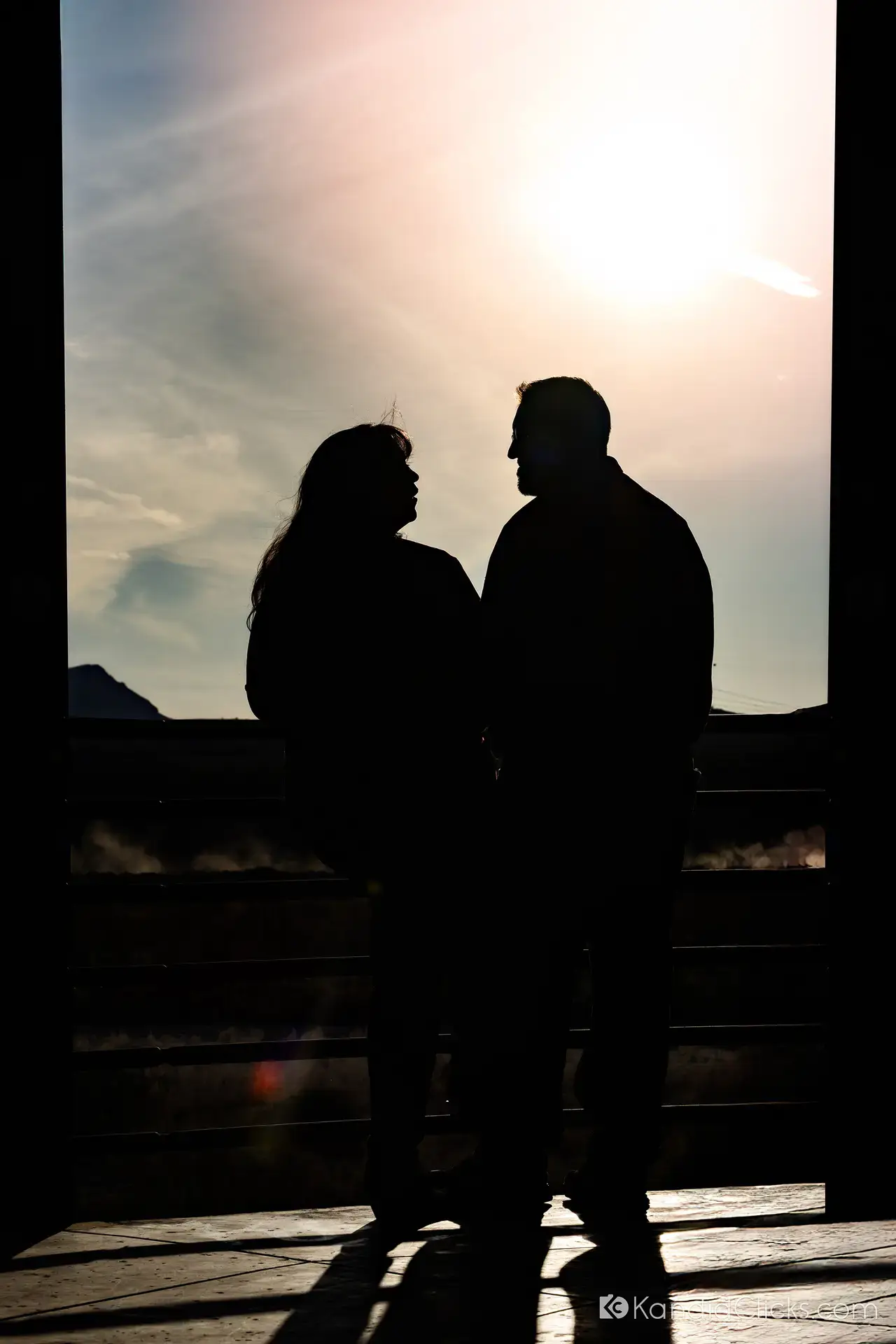Silhouette of a couple sharing a quiet moment during sunset in Arizona.