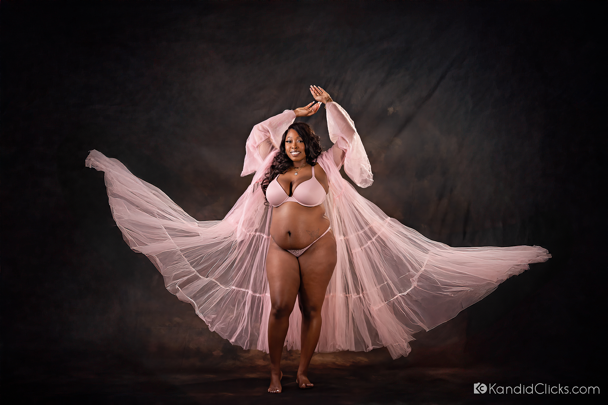 glamorous maternity photography arizona studio portrait pink robe