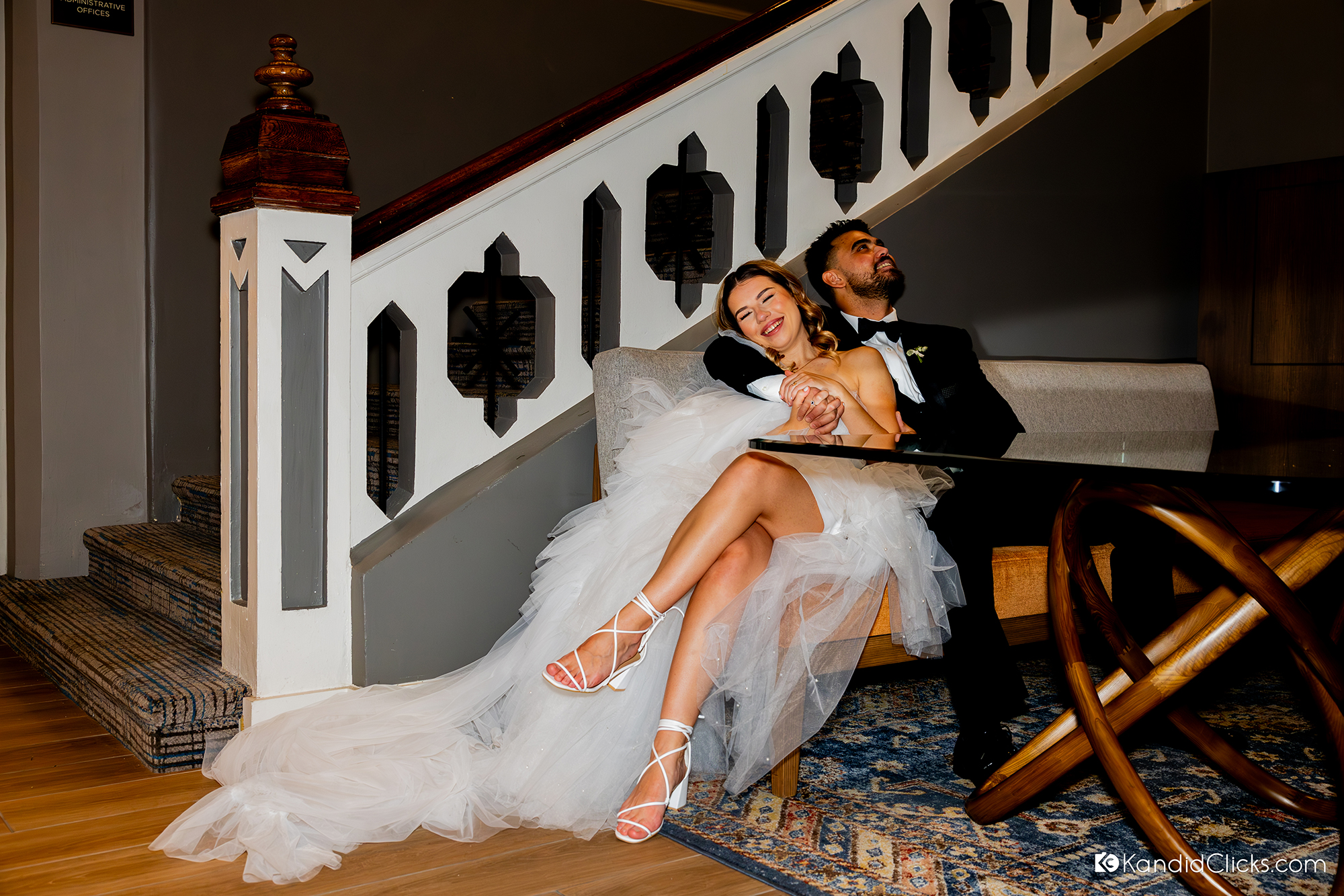 bride and groom relaxing indoors after wedding ceremony