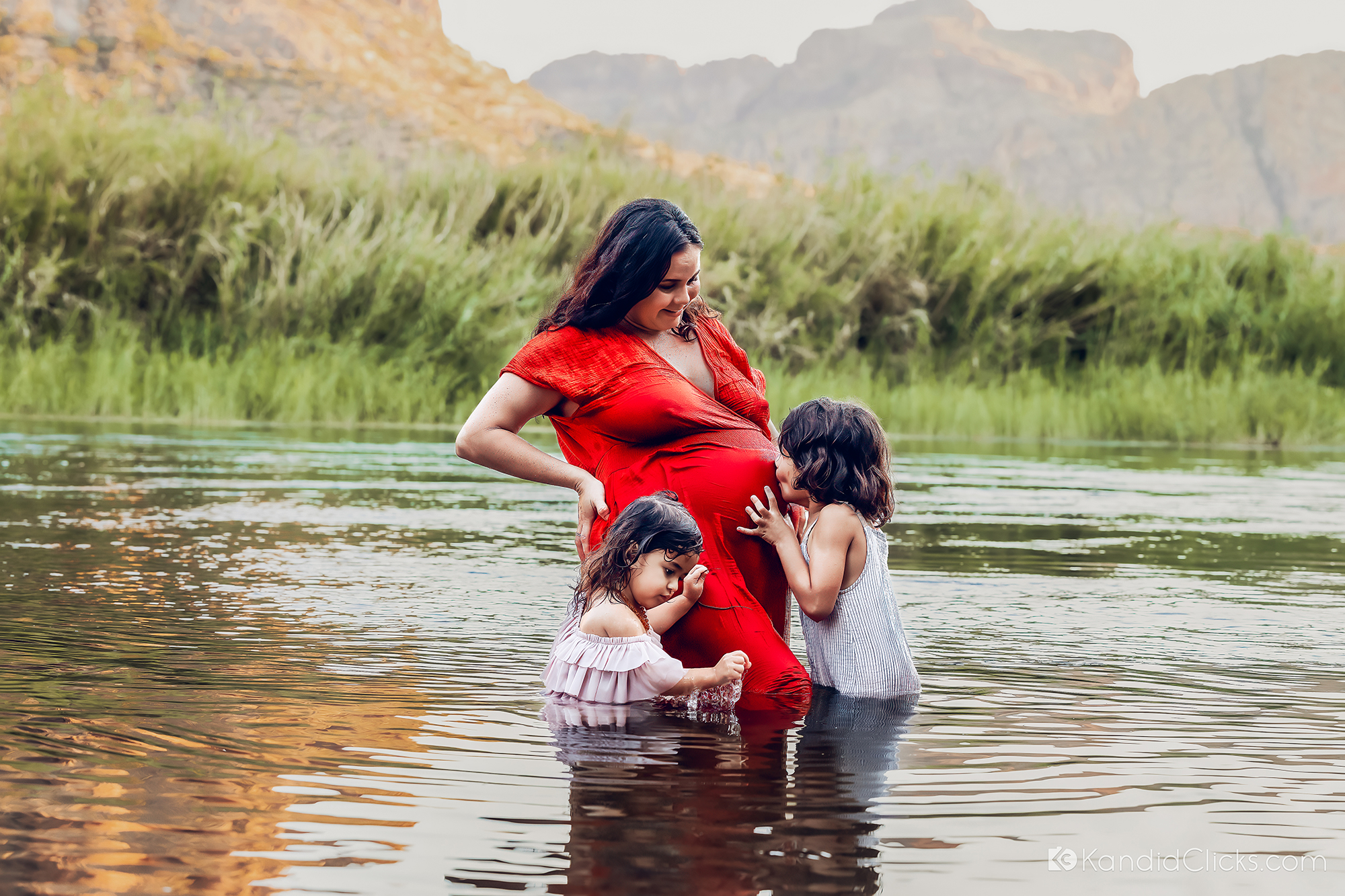maternity photography arizona mother and daughters in river red dress