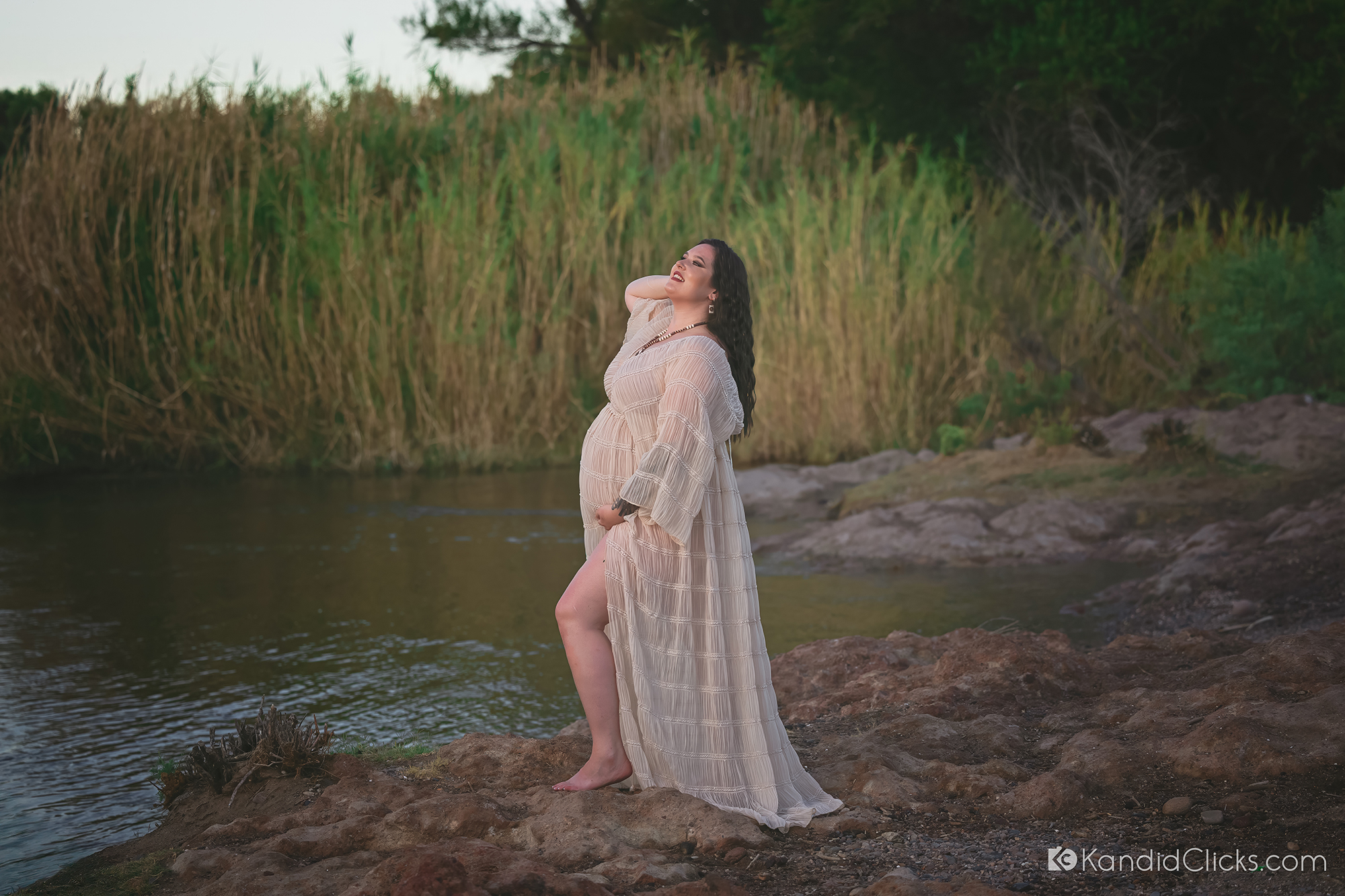 Confident Outdoor Maternity Portrait on Rocky Riverbank – Phoenix, AZ