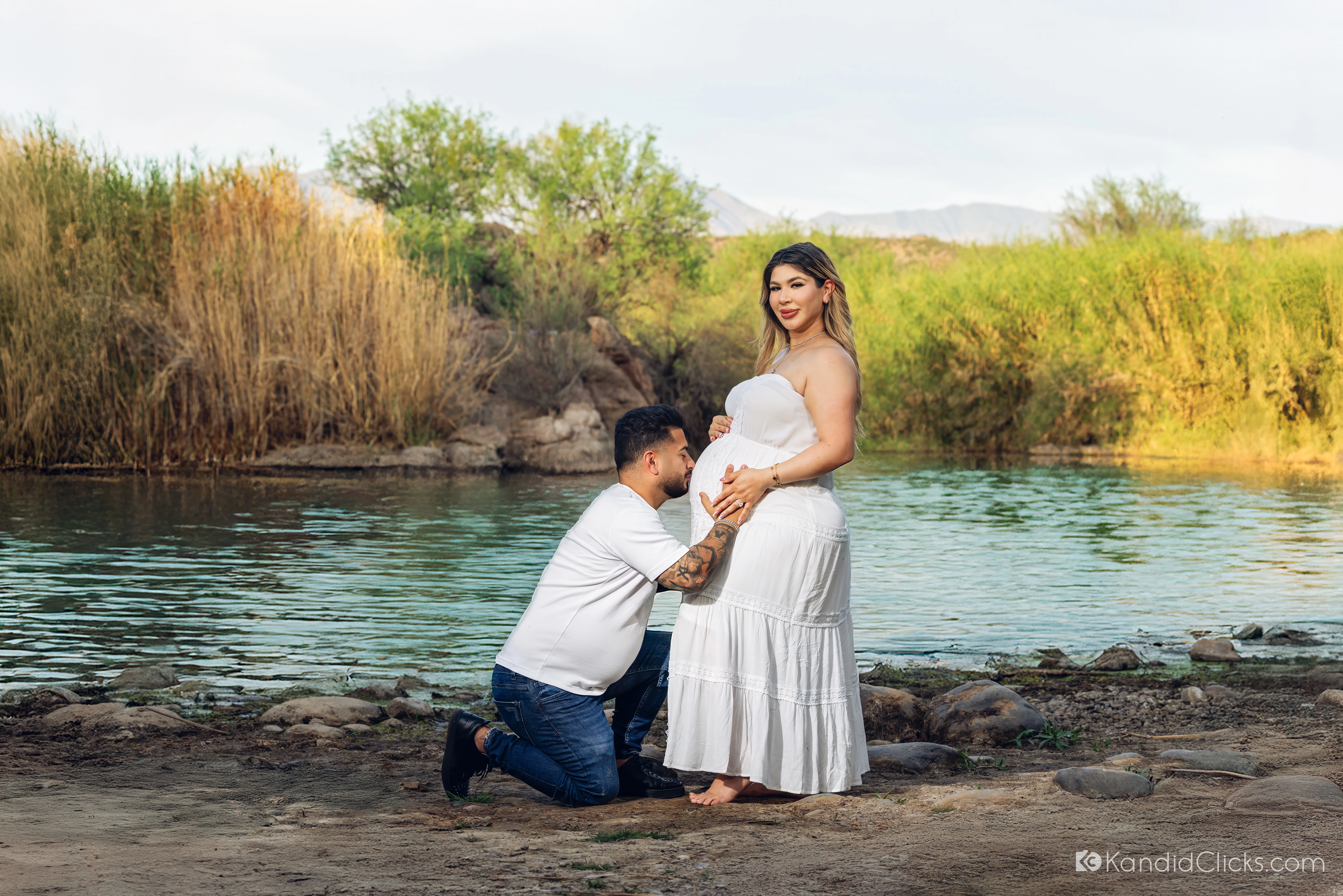Wide view of Monica along the Salt River during her golden-hour maternity session.